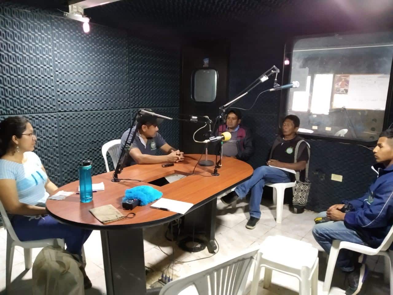people broadcasting in a comlobia community radio studio